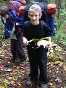 middle schooler in backpack
